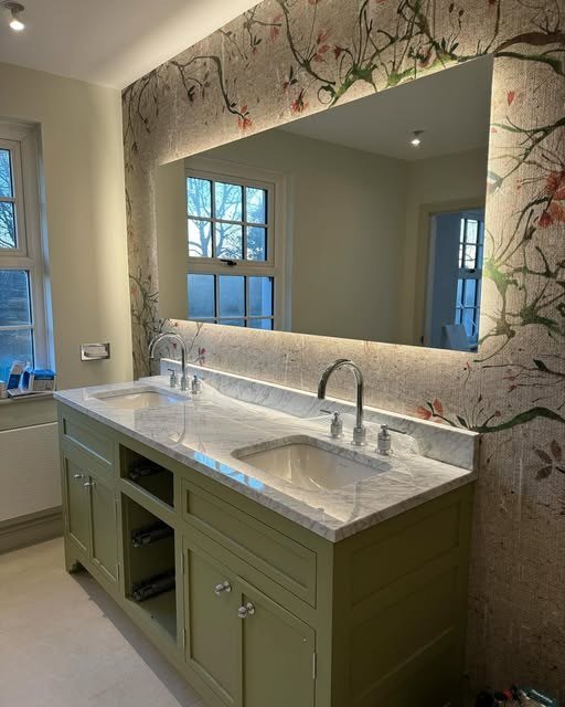 Bathroom with backlit mirror and feature wall