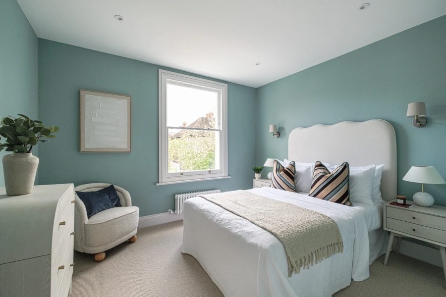 Bedroom with recessed downlights and bedside wall lights