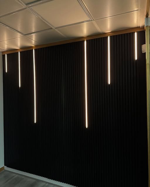 Slatted feature wall with integrated LED strip lighting