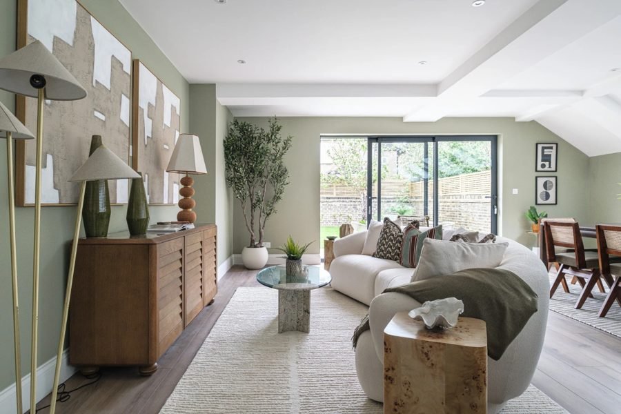 Open-plan living area with recessed ceiling lights, table lamps and floor lamps