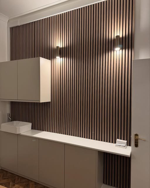 Wall lights on a slatted feature wall